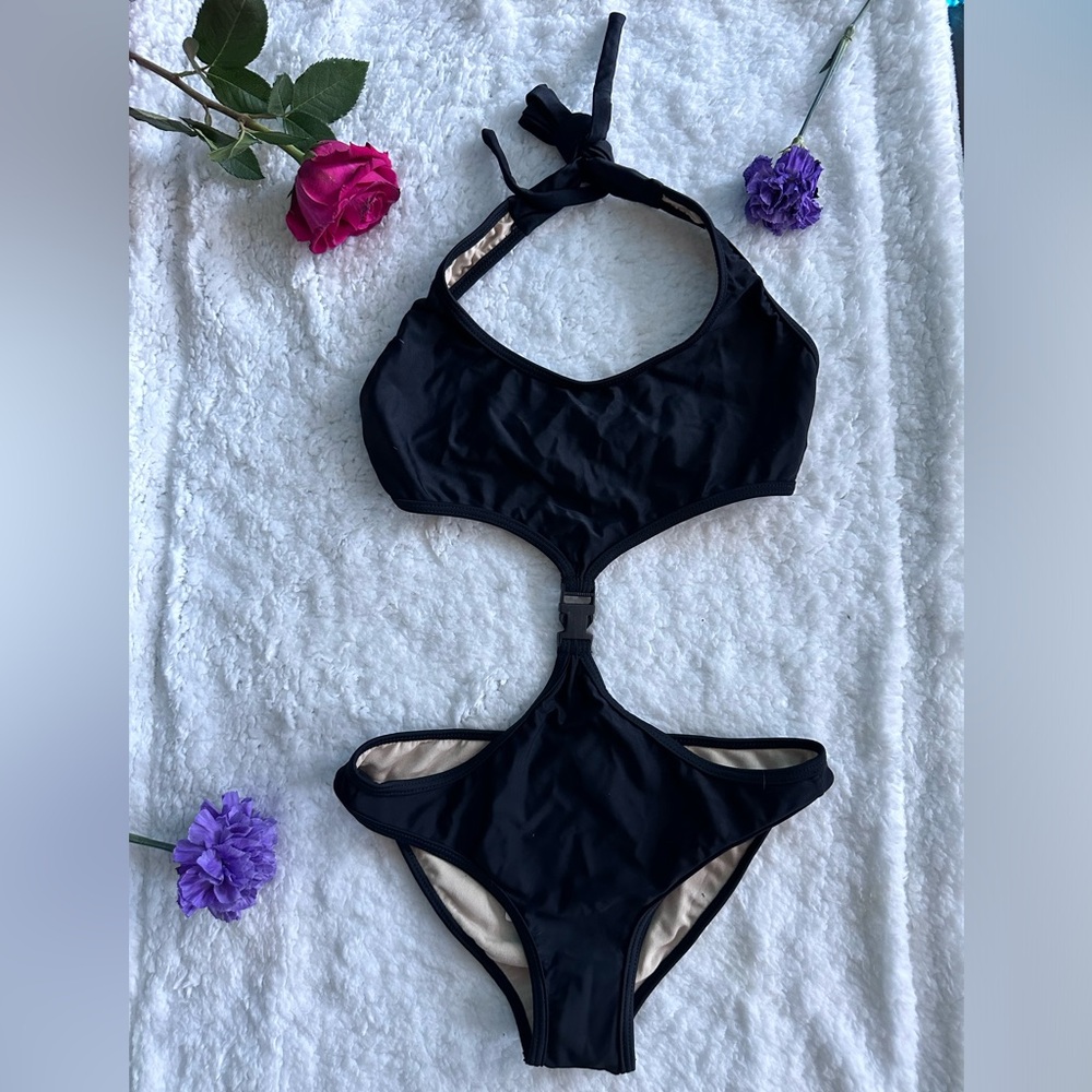 Black one piece swimsuit with buckle attachment